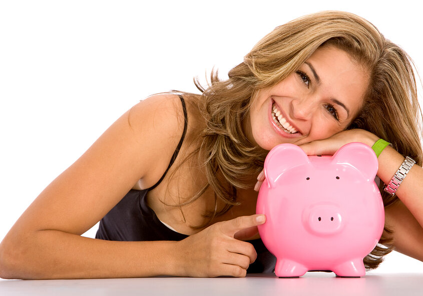 casual woman looking to save money in a piggy bank